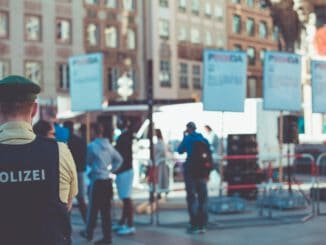 people walking on road near buildings