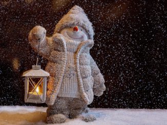 snowman with white scarf and white snowman hat