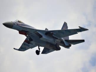 plane under white clouds